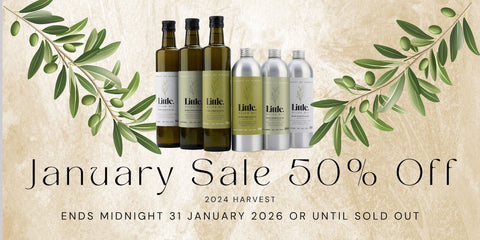 january sale banner 50 per cent off showing little olive oil bottles with olive branches